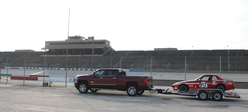 Illustration for article titled Towing A Race Car With A Small House: The Silverado 2500 High Country